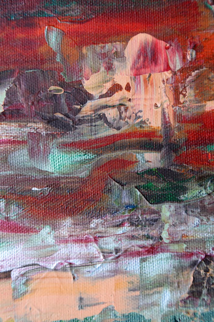 Dynamic abstract art with rich textures and vibrant colors on canvas.