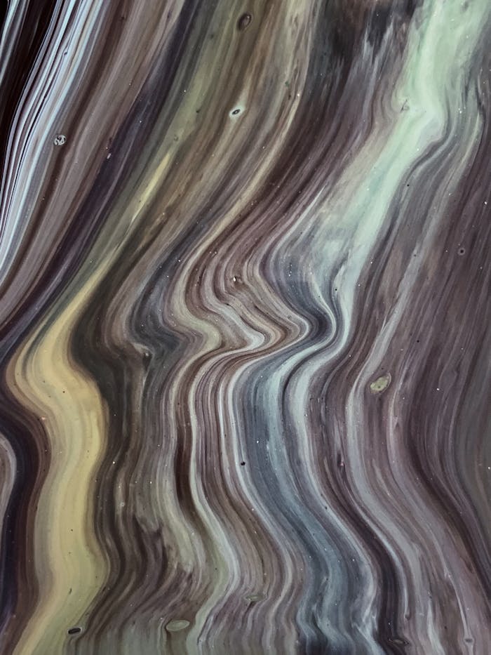 A mesmerizing abstract painting showcasing flowing patterns and earthy tones, perfect for artistic backgrounds.